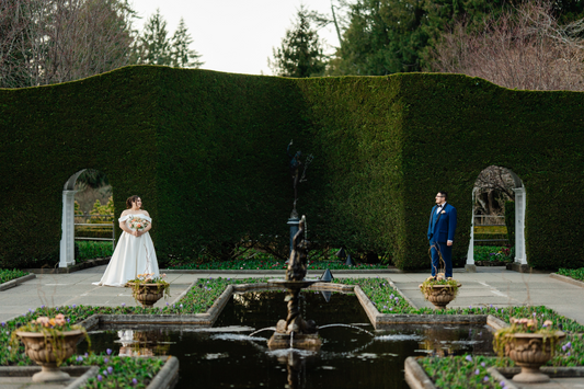 The couple shares a quiet first look in the Prelude Garden at Butchart Gardens, captured by Jon-Mark Photography in Victoria, BC