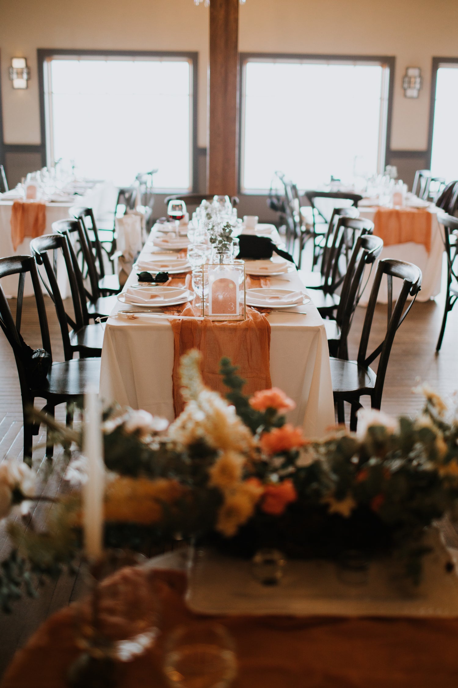 a set wedding table set in orange and earthy tones