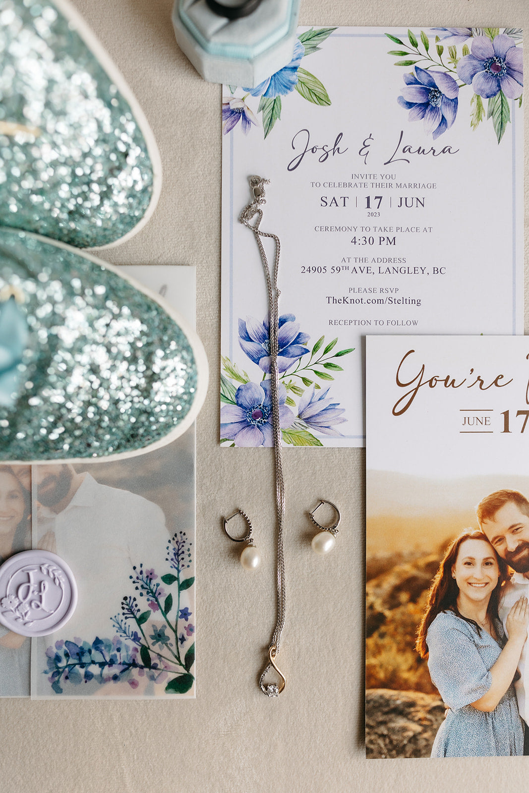 a flatlay image of an imitation with blues and greens, and a pair of sparkly blue sneakers